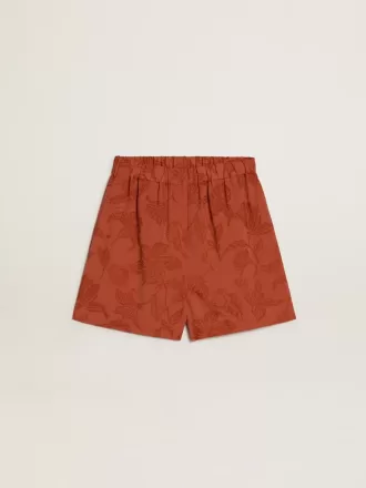 Damershorts i murstensrød jacquard med marineblåt blomstermønster