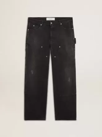 Herrejeans i slidt sort bomuld med patches foran