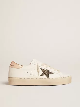 Hi Star LTD med sort og guldglitterstjerne og guldhælkappe