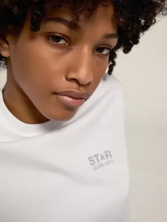 Hvid T-shirt til kvinder med sølvglitterlogo og stjerne
