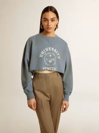Kort sweatshirt i babyblå med distressed finish