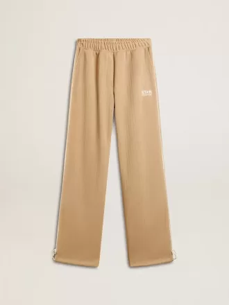 Lys beige joggingbukser til kvinder med hvidt logo