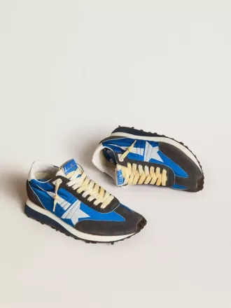 Marathon til kvinder med blå nylonoverdel og hvid stjerne