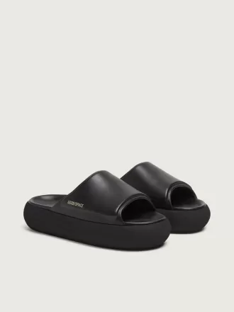 Space-Star Slide slip-ons til kvinder i sort læder